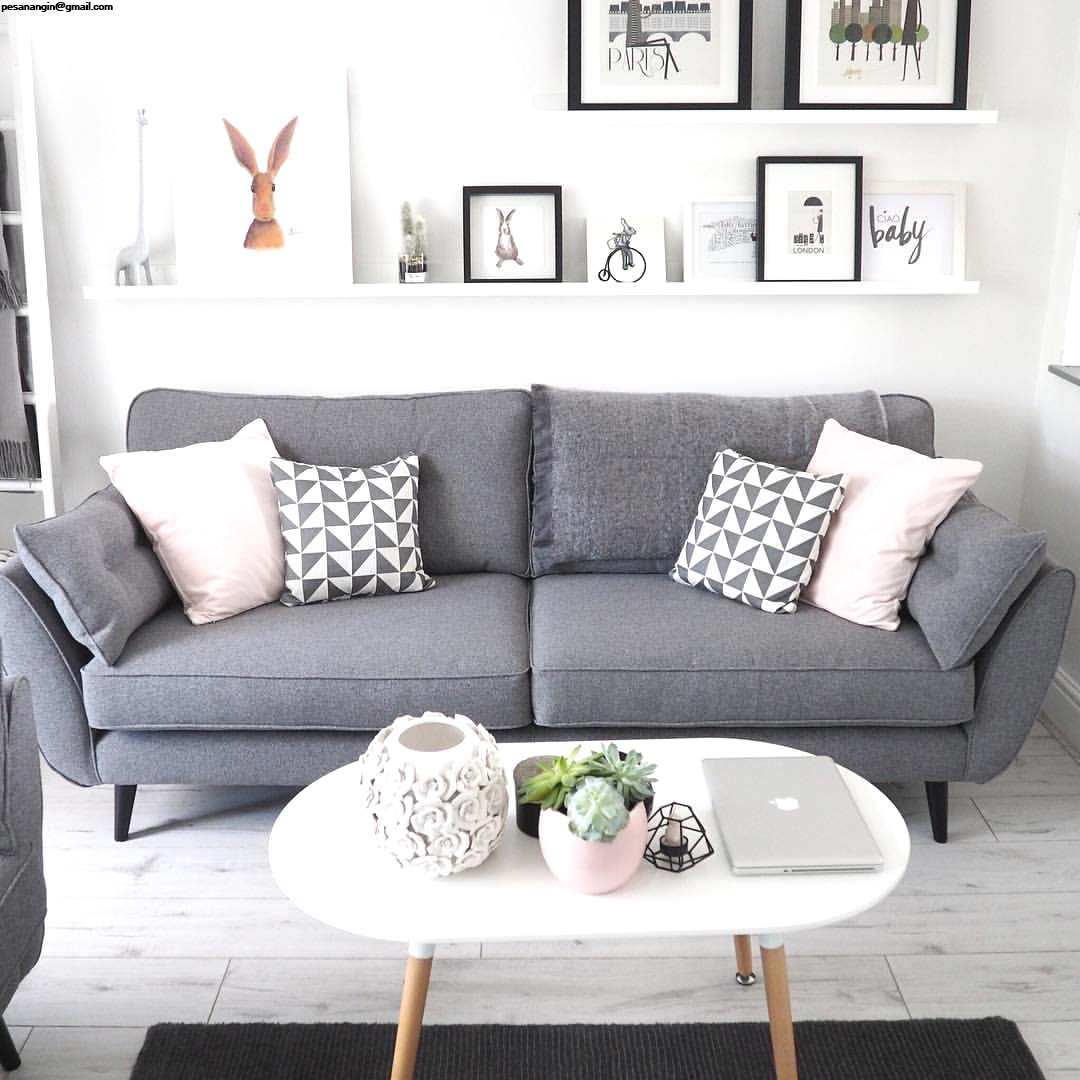 gray sofa with patterned throw pillows