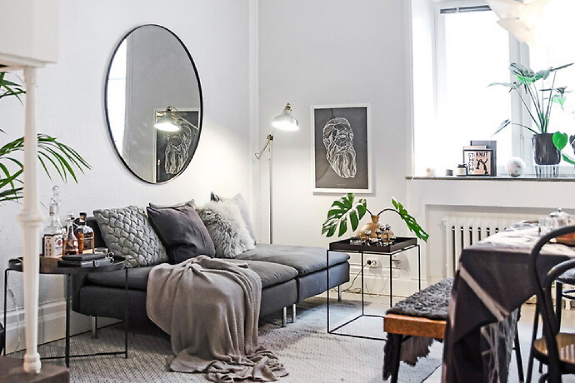 lounge area with large round mirror