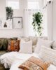 Living room with hanging plants and throw pillows with different textures