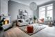 Grey living room with a fireplace in the corner