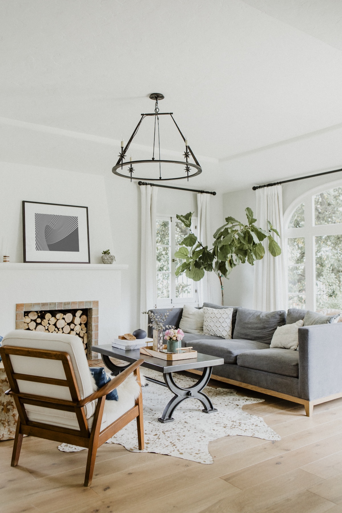 combine paintings with unique lighting fixtures