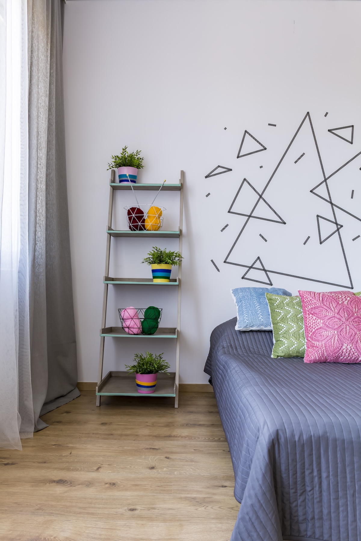 A short ladder used as a nightstand