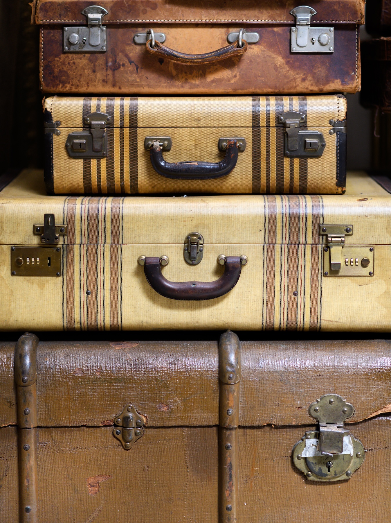 Stacks of vintage suitcases used as a nightstand